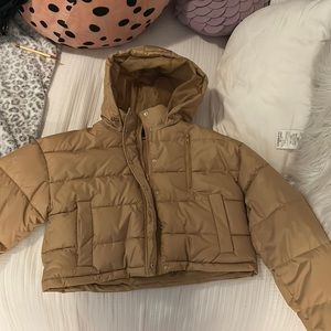 Tan puffer jacket from PacSun.